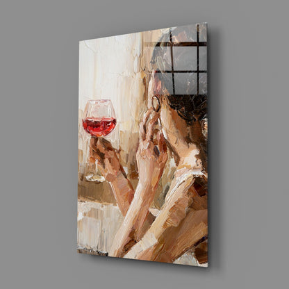 Angled view of glass art panel showing woman with red wine glass against warm beige and brown brushstroke background with black grid overlay.