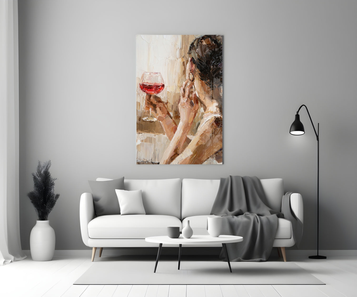 Abstract portrait painting of woman holding red wine glass displayed above white sofa in modern living room.