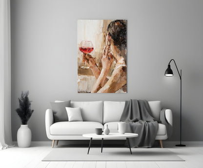 Abstract portrait painting of woman holding red wine glass displayed above white sofa in modern living room.