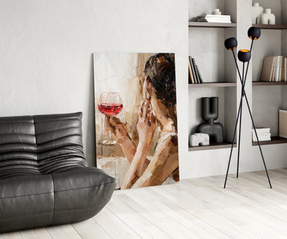 Wine and Women glass art canvas displayed in modern living room with black leather sofa and shelving.