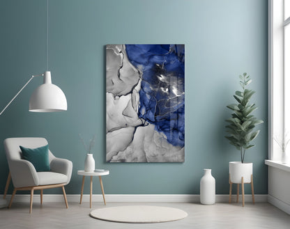 Blue Marble Glass Art displayed on turquoise wall above white chair in minimalist room setting.