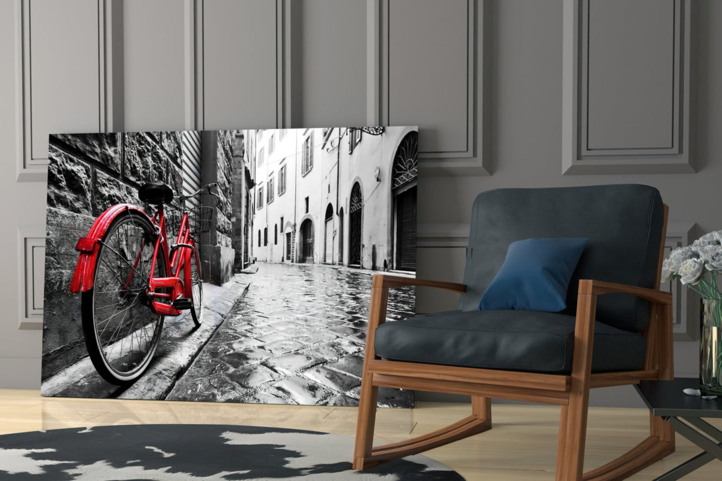 Red bicycle leaning against stone wall in black and white European street scene displayed as glass art panel in modern living room.