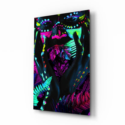 Angled perspective view of neon glass art panel displaying vibrant fluorescent pink, cyan, yellow, and purple botanical and geometric patterns against black background.