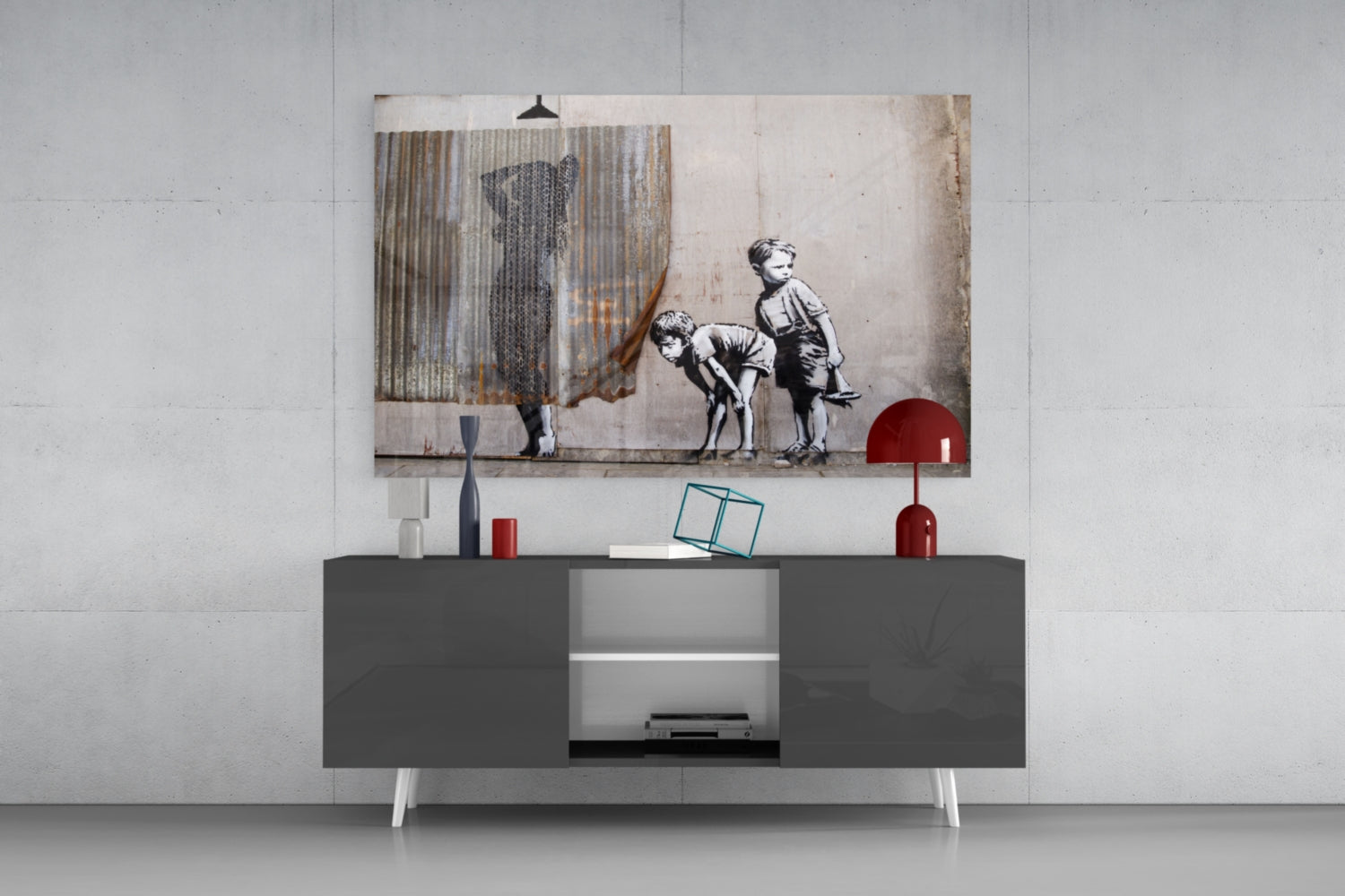 Curiosity Glass Art print displayed above a gray media console, showing children in black and white sketch style with corrugated metal overlay and red accents.