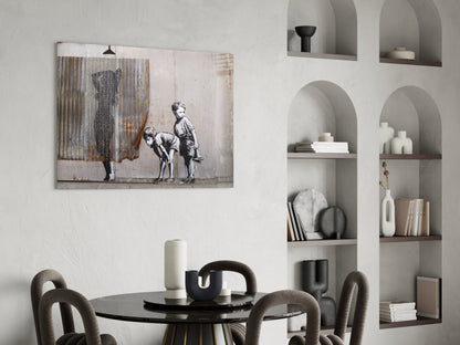 Curiosity glass art print displayed above black round dining table with gray upholstered chairs in modern white interior.