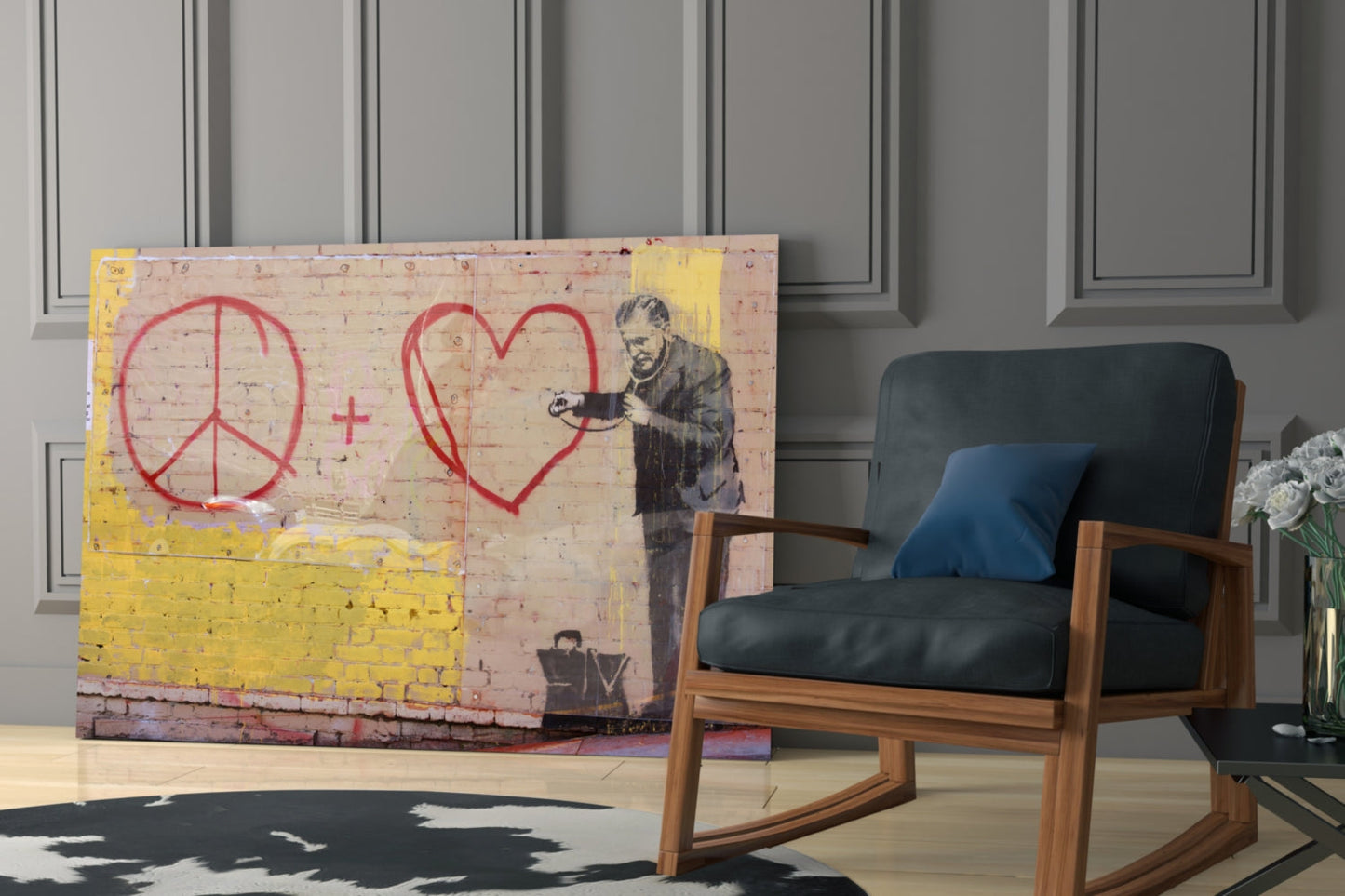 Graffiti Doctor glass art featuring red peace symbol and heart with stenciled figure, displayed in modern living room beside wooden chair.