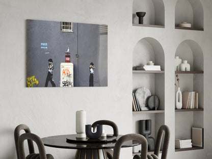 Street art style glass print depicting figures with "FREE DOLLAR" text displayed above modern dining table in minimalist interior.