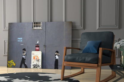 Modern interior with dark blue-grey Banksy-style street art glass panel featuring "FREE DOLLAR" text and stenciled figures displayed against paneled wall next to wooden chair.