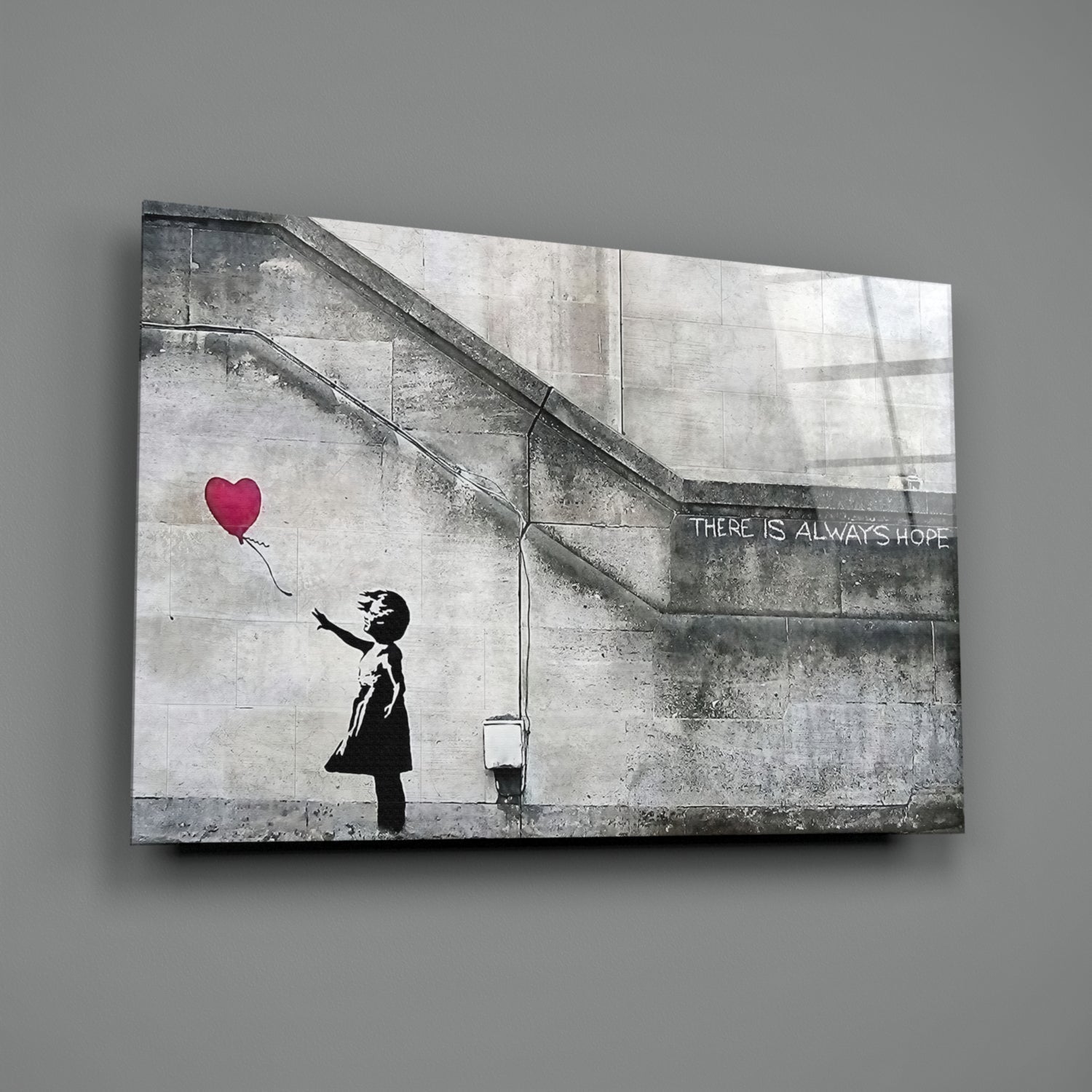 Canvas print of Banksy-style stencil art showing silhouetted child reaching for red heart balloon with "THERE IS ALWAYS HOPE" text.