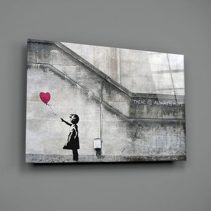 Canvas print of Banksy-style stencil art showing silhouetted child reaching for red heart balloon with "THERE IS ALWAYS HOPE" text.