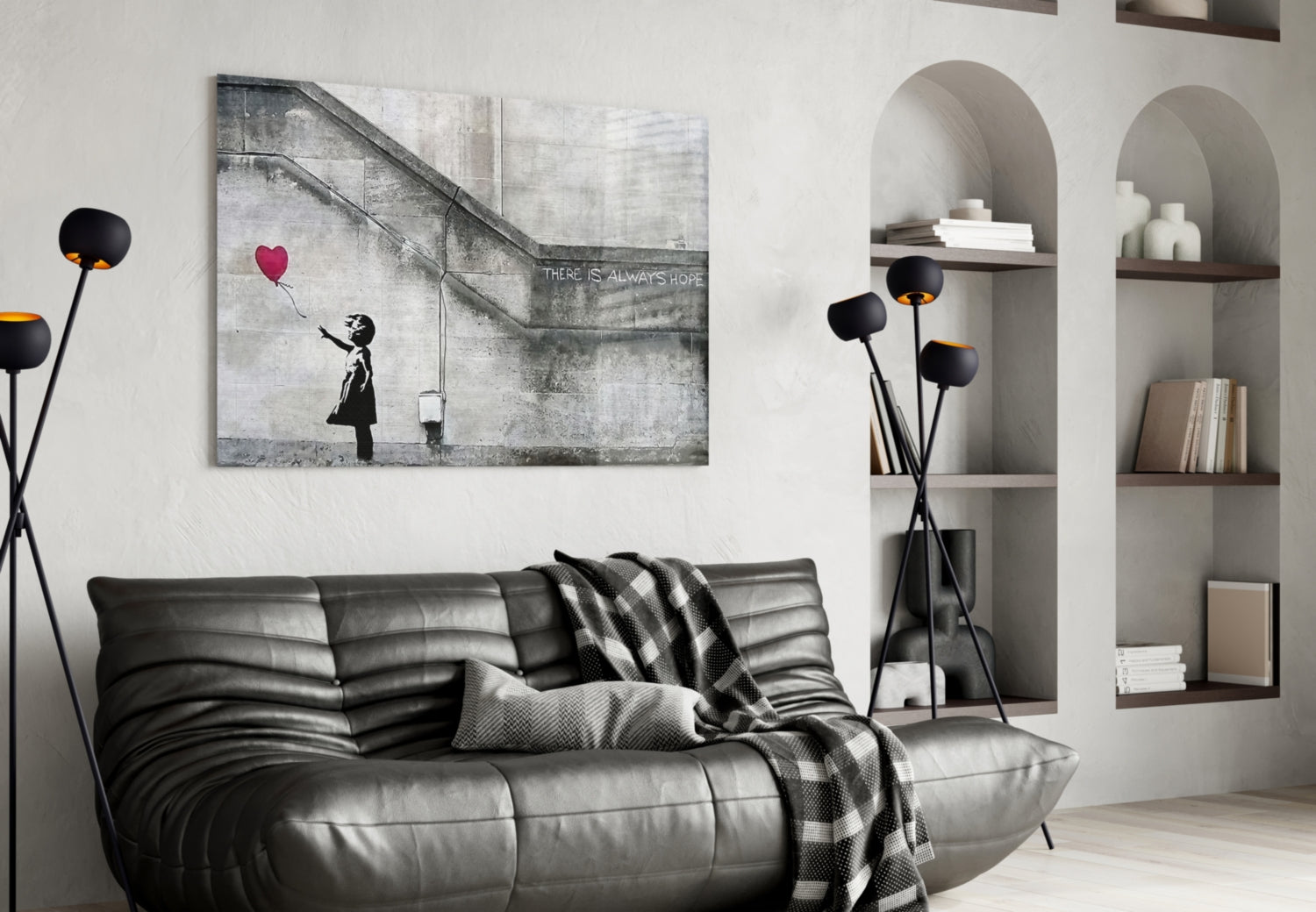 Black stem glass art with glowing orange heart-shaped blooms displayed in modern living room interior.