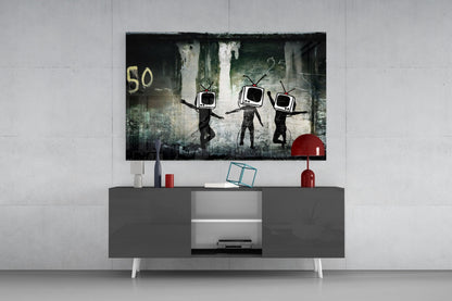 Modern living room setup with TV Heads Glass Art mounted above gray media console, featuring three figures with television screens for heads against distressed urban background.