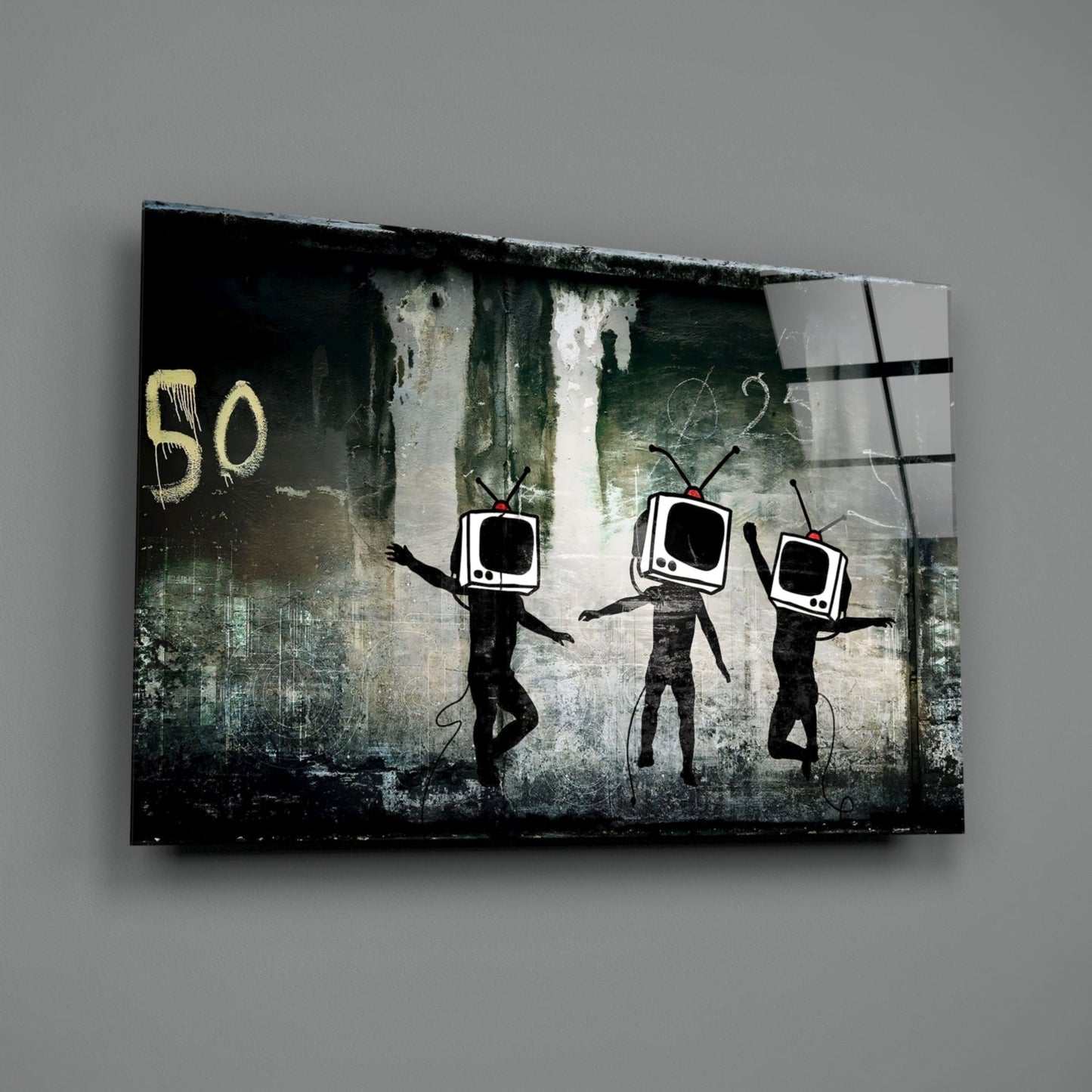 Three stick figures with TV heads dance against distressed green and white wall backdrop with yellow "50" text, displayed as glass art panel.