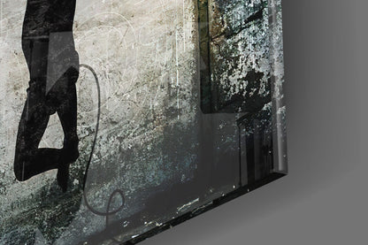TV Heads Glass Art displayed at an angle against weathered concrete wall with lichen and moss growth.