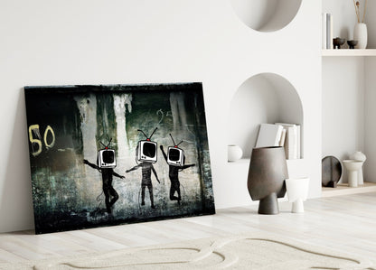 Glass art leaning against white wall depicting three black stick figures with television screens for heads against textured dark background.