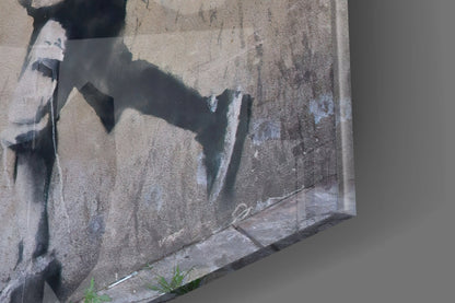 Stenciled rat street art on weathered concrete wall with white spray paint and dark shadows.