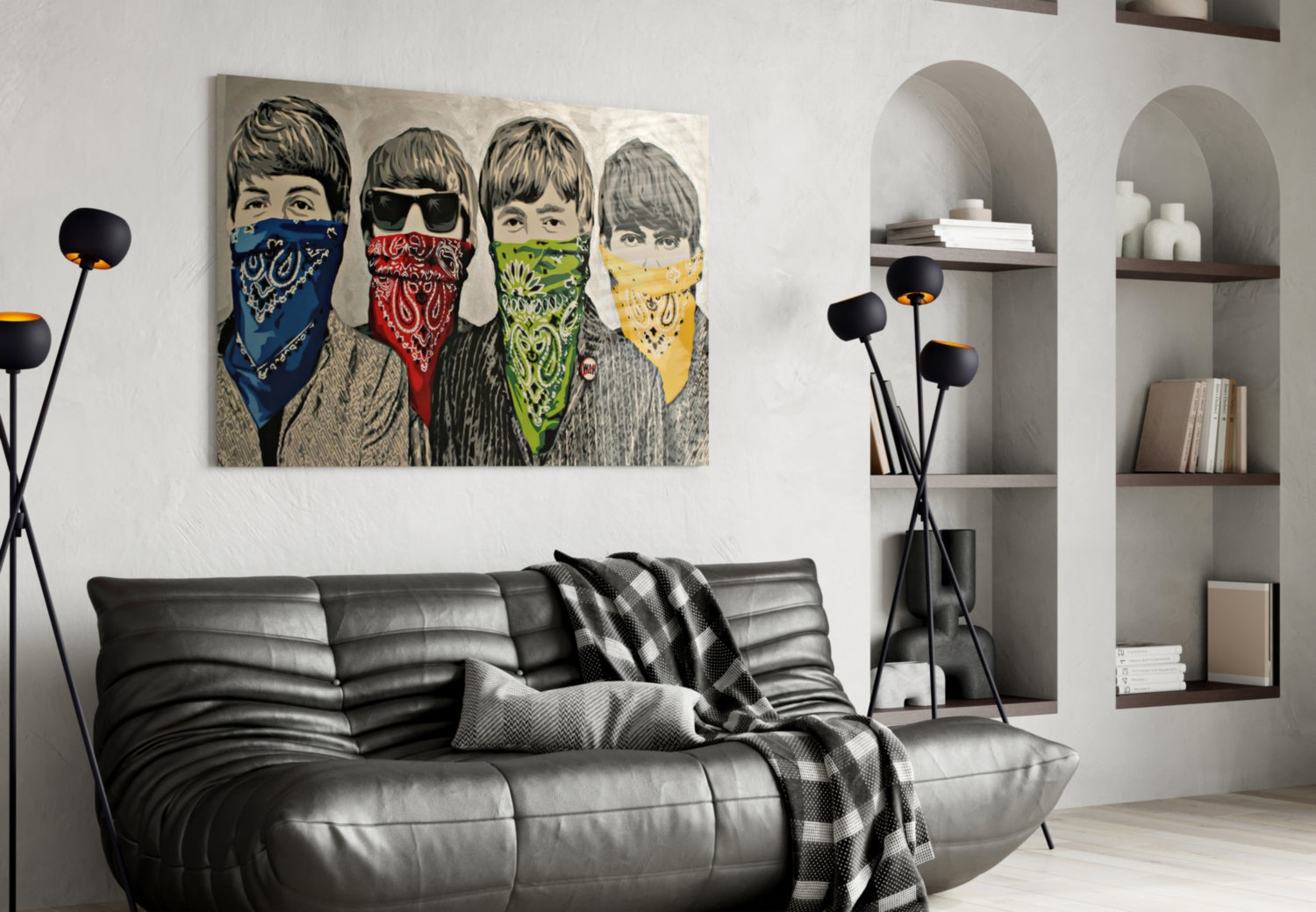 Modern living room with black leather sofa displaying pop art canvas of four youths wearing colorful bandanas above it.