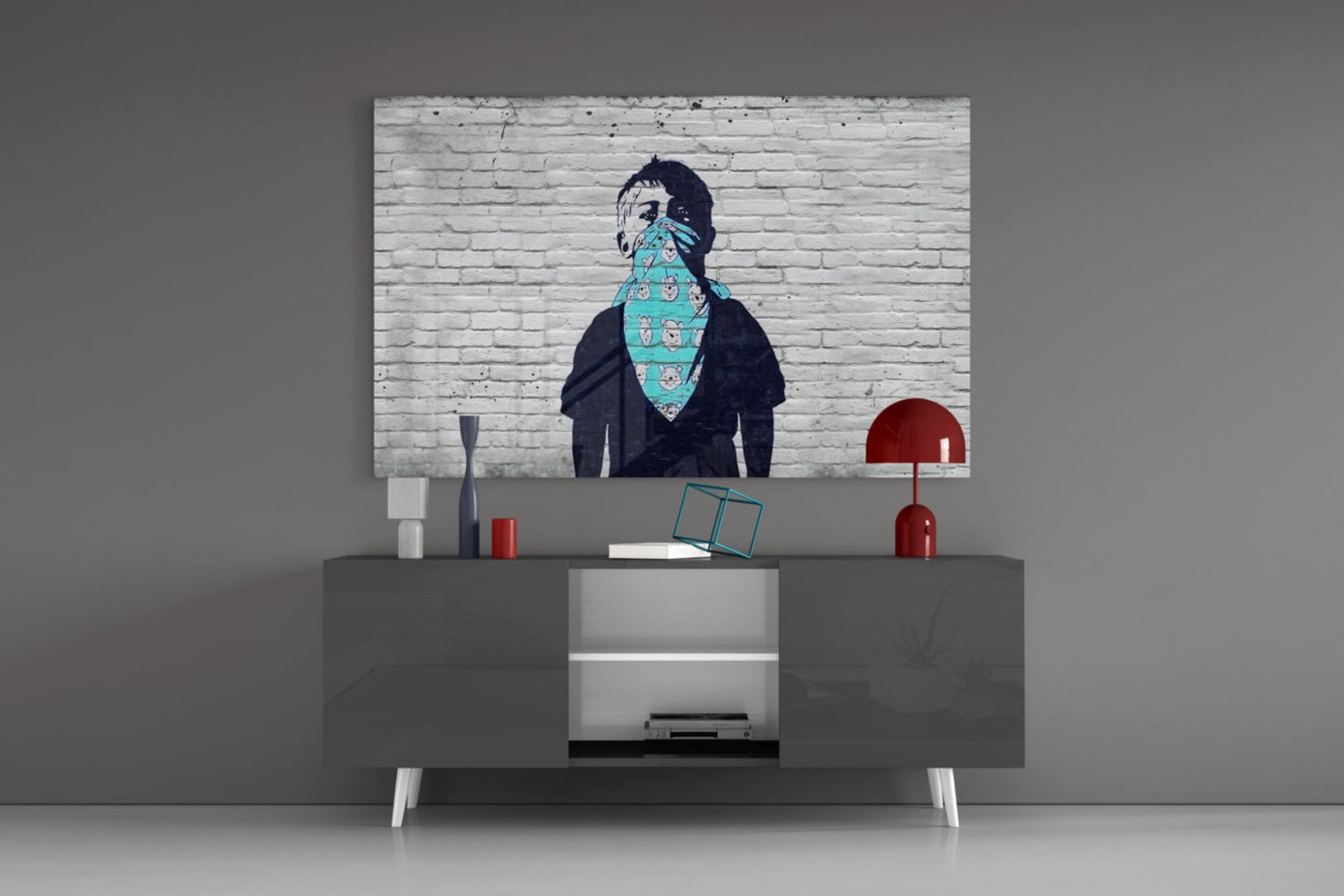 Street art print of figure with turquoise bandana displayed above gray media console with red lamps.