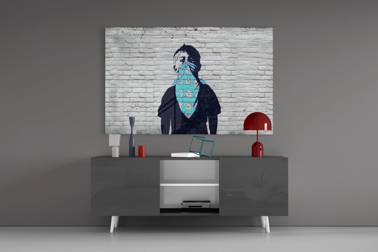 Street art print of figure with turquoise bandana displayed above gray media console with red lamps.