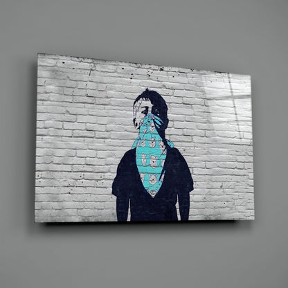 Street art mural on white brick wall depicting figure with face covered by turquoise patterned bandana.