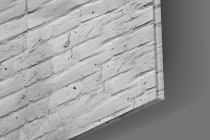 Close-up angled view of white textured glass surface with black speckles and brushstroke patterns.