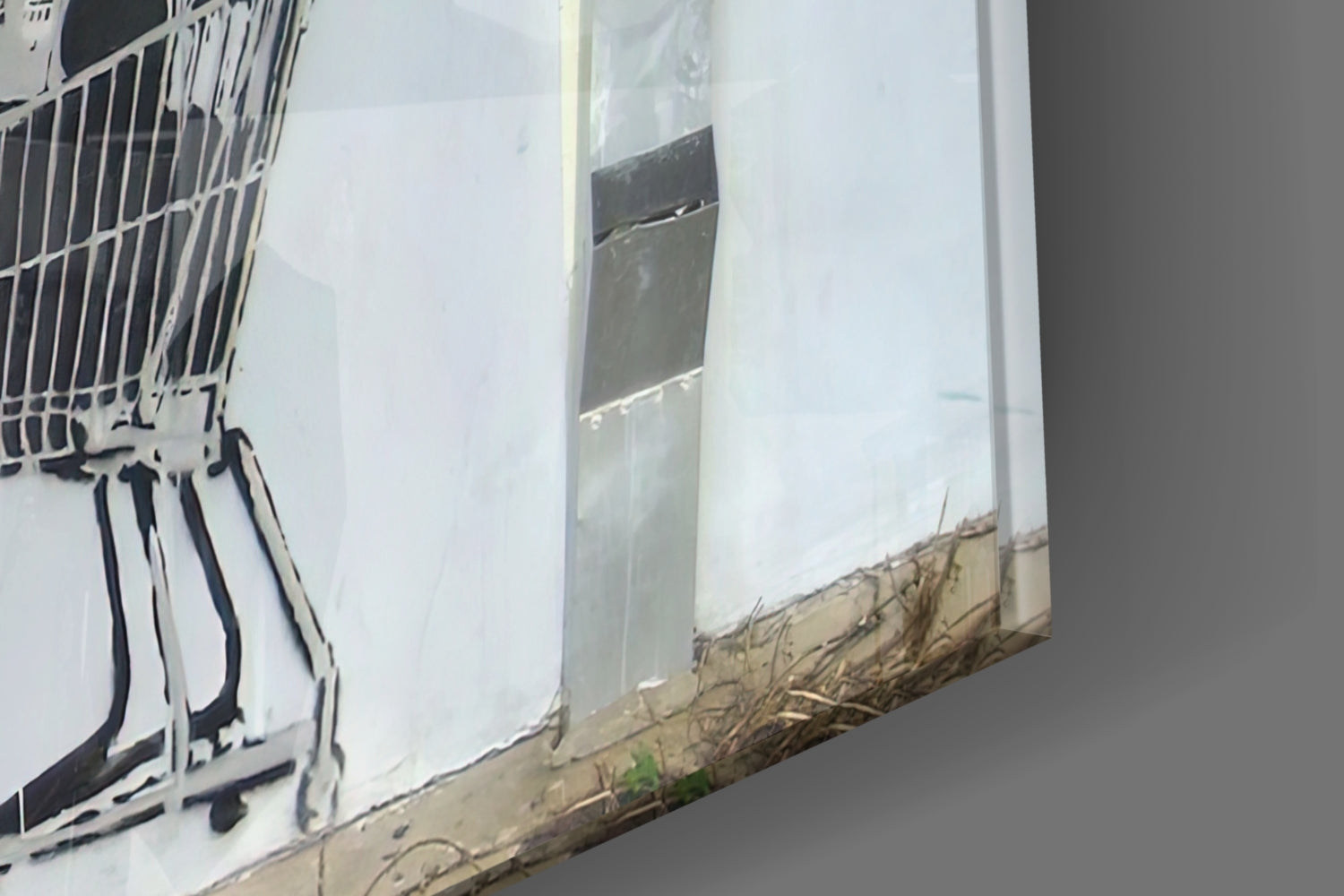 Close-up of glass art panel showing white translucent glass with black striped design and tan wooden base detail.