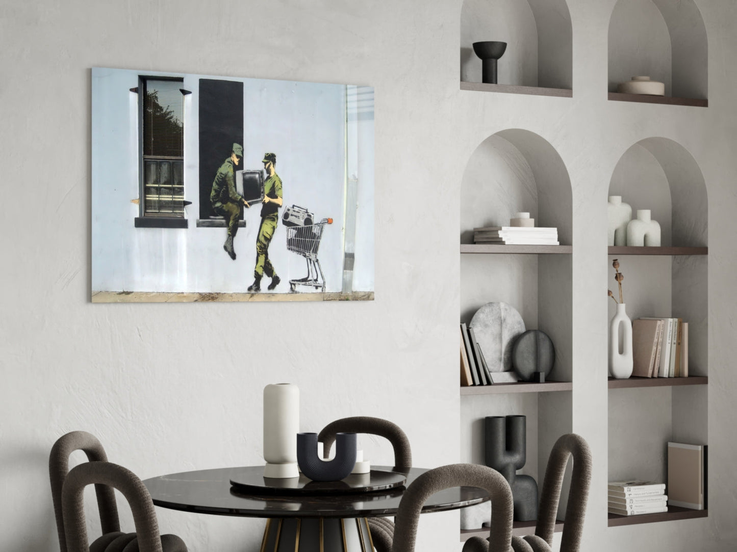 Soldier Glass Art depicting two military figures in camouflage exchanging a shopping cart, displayed above a round black dining table in a modern interior.