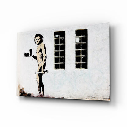 Canvas print of stenciled figure holding cityscape, standing beside two tall windows on white wall.