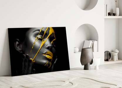 Yellow paint glass art leaning against white wall in minimalist interior with neutral decor and shelving.