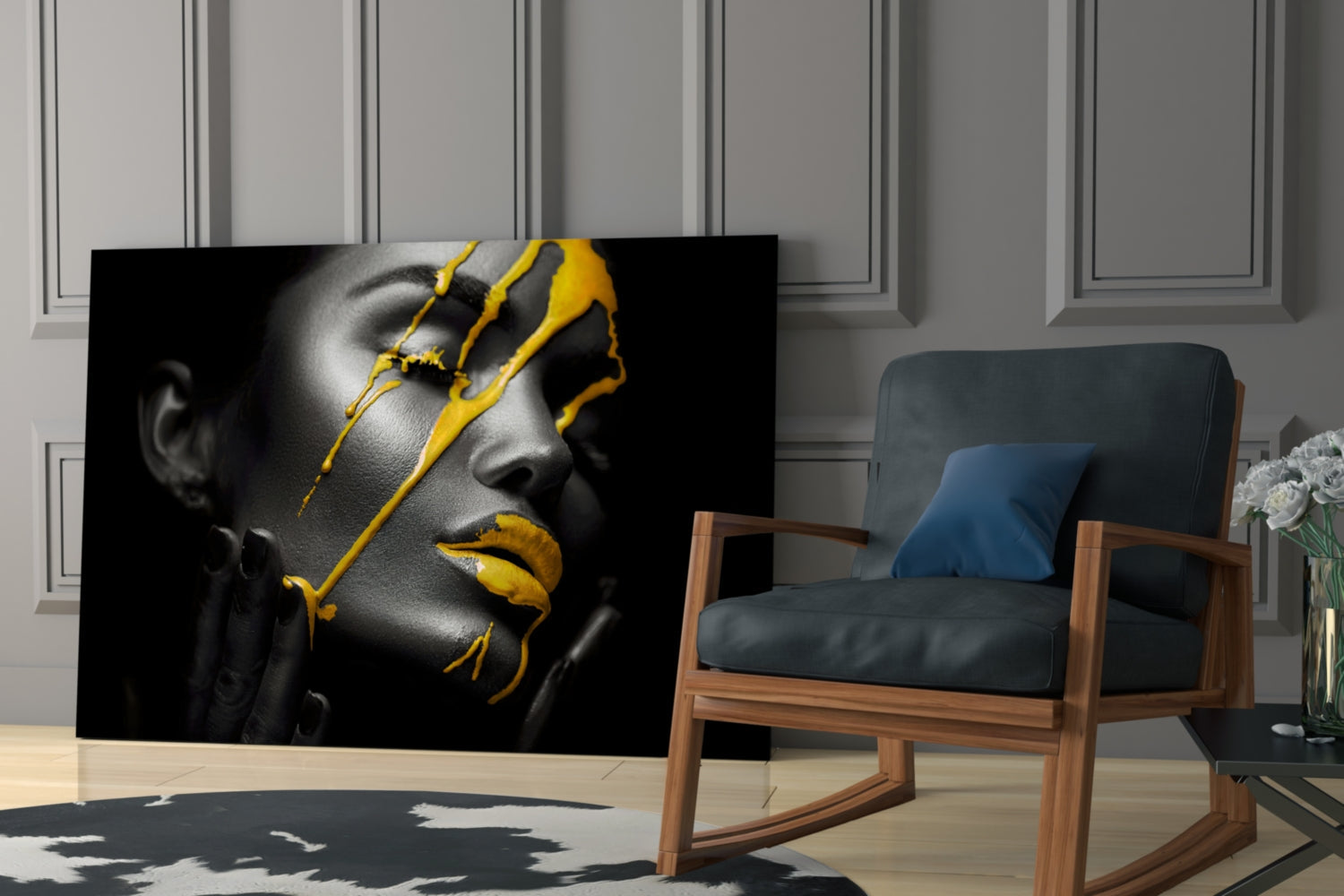 Black and white portrait with bold yellow paint strokes across face and lips, displayed in modern living room setting.