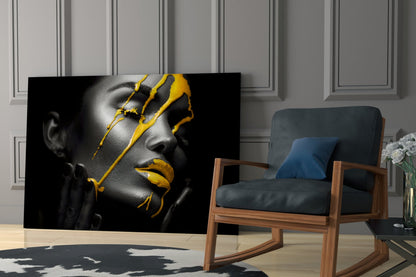 Black and white portrait with bold yellow paint strokes across face and lips, displayed in modern living room setting.