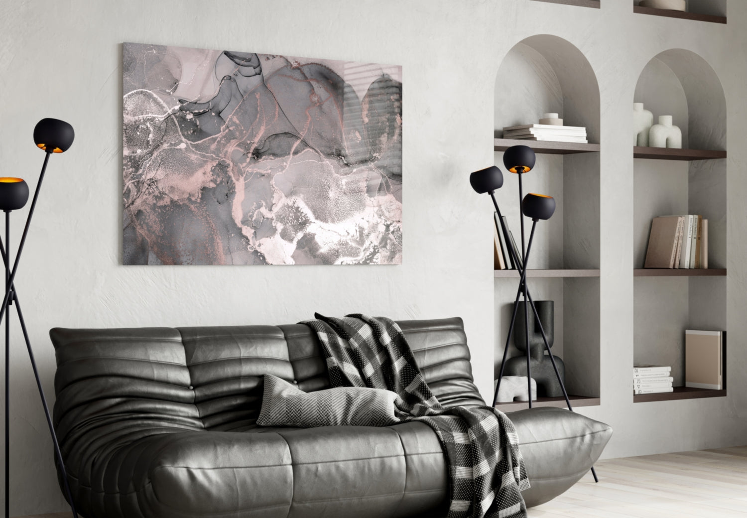 Sweet Pink Glass Art displayed on white wall above black leather sofa in modern living room interior.
