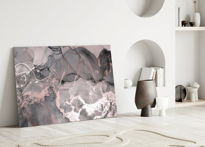 Sweet Pink Glass Art leaning against white wall in minimalist interior with sand, ceramics, and shelving.