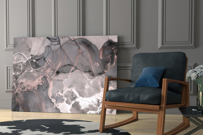 Abstract pink and grey marbled glass art displayed in modern living room with wooden chair and paneled wall.