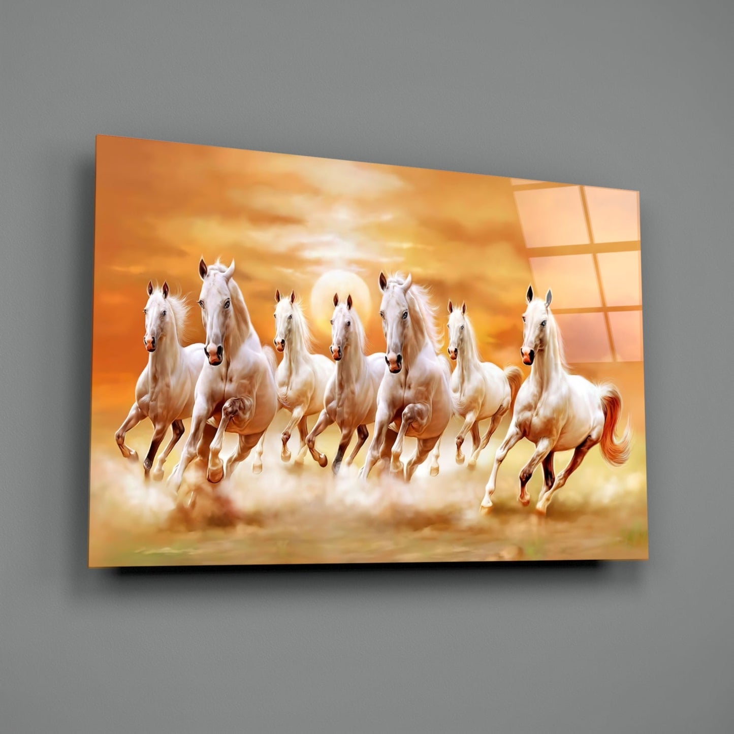 Seven white horses galloping through golden dust against an orange sunset sky on a glass art panel mounted on gray wall.