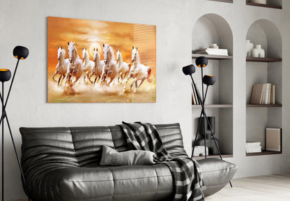 Running Horses Glass Art displayed above black leather sofa in modern living room with white walls and arched shelving.