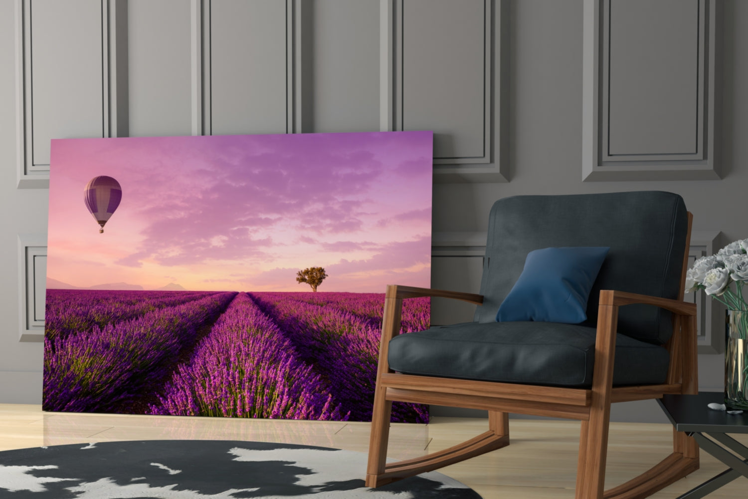 Curved glass art panel displaying purple lavender field with hot air balloon and pink sunset sky, displayed in modern room setting beside wooden chair.