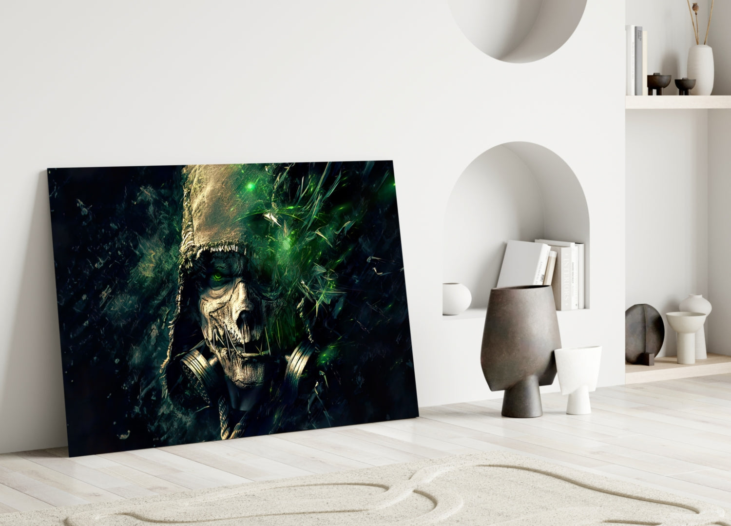 Dark fantasy skull artwork with green glowing eyes and gold accents leaning against white minimalist interior wall.