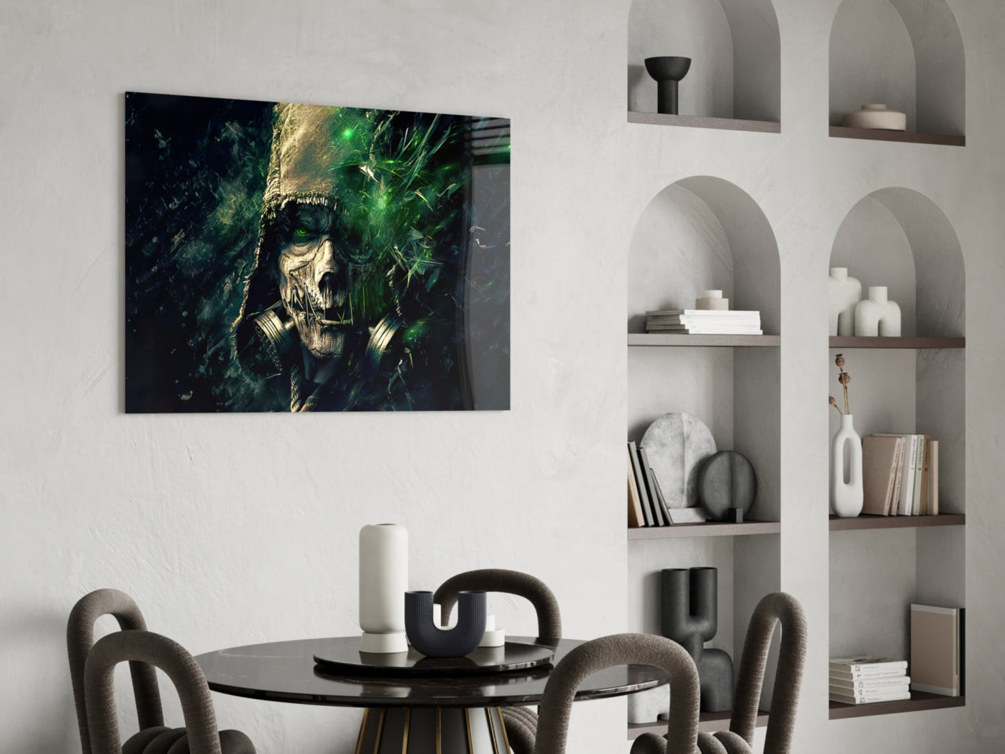 Dark moody glass art featuring a skull with green glowing effects displayed above a dining table in a modern interior.