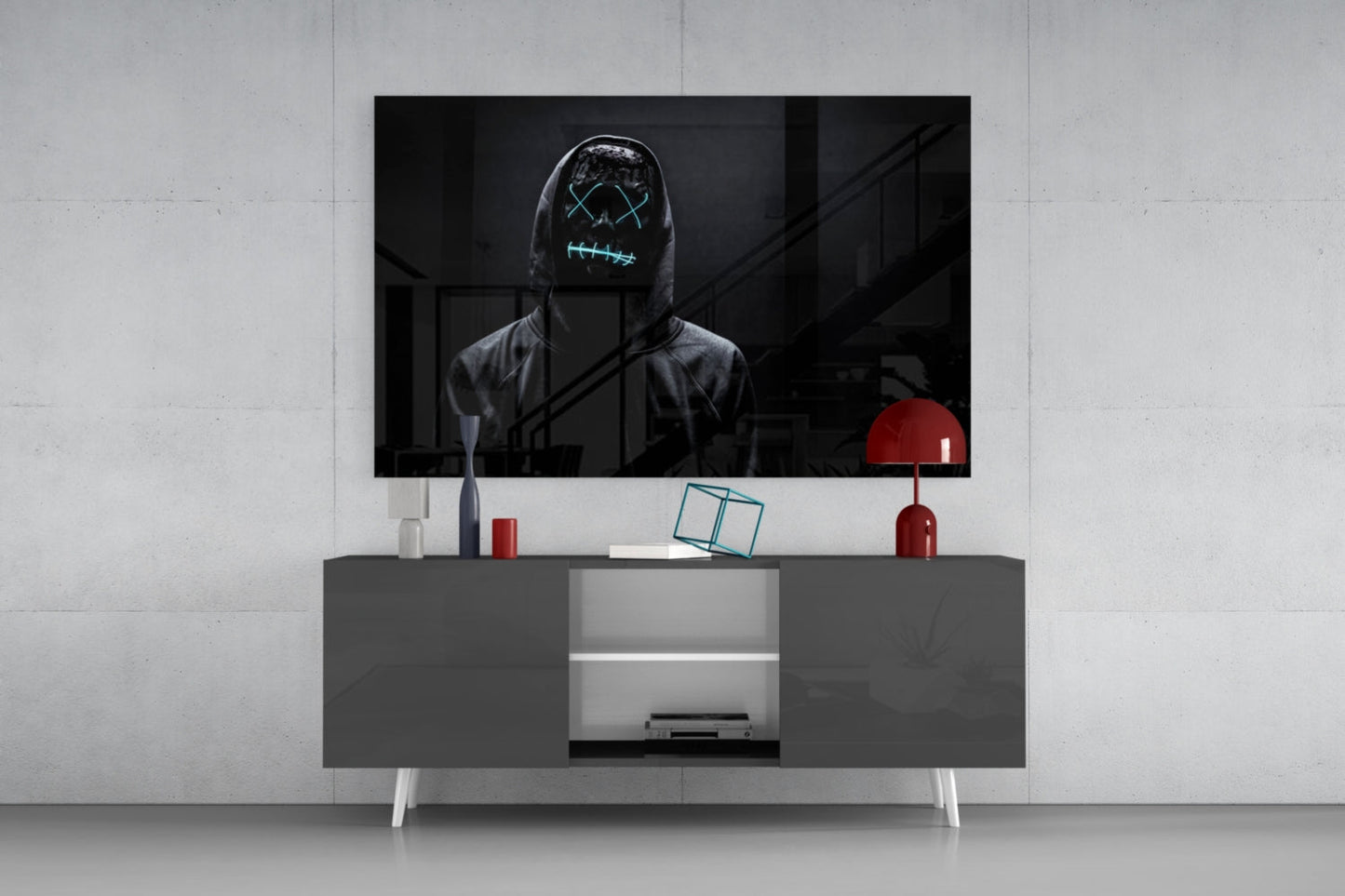 Modern living room setup with gray media console displaying neon-masked figure artwork on mounted TV and red decorative accessories.