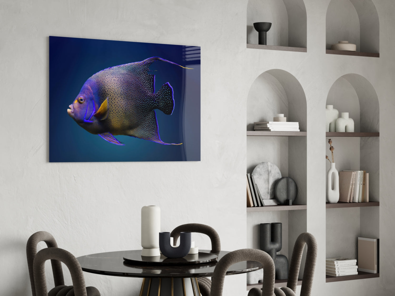 Queen Angelfish glass art mounted on white wall above dining table, displaying purple and gold fish against deep blue gradient background.