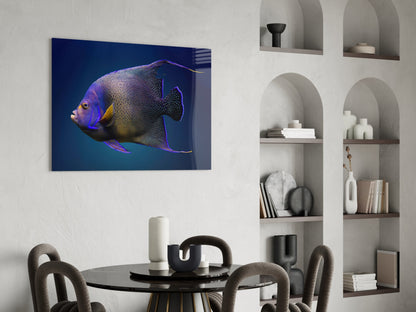 Queen Angelfish glass art mounted on white wall above dining table, displaying purple and gold fish against deep blue gradient background.