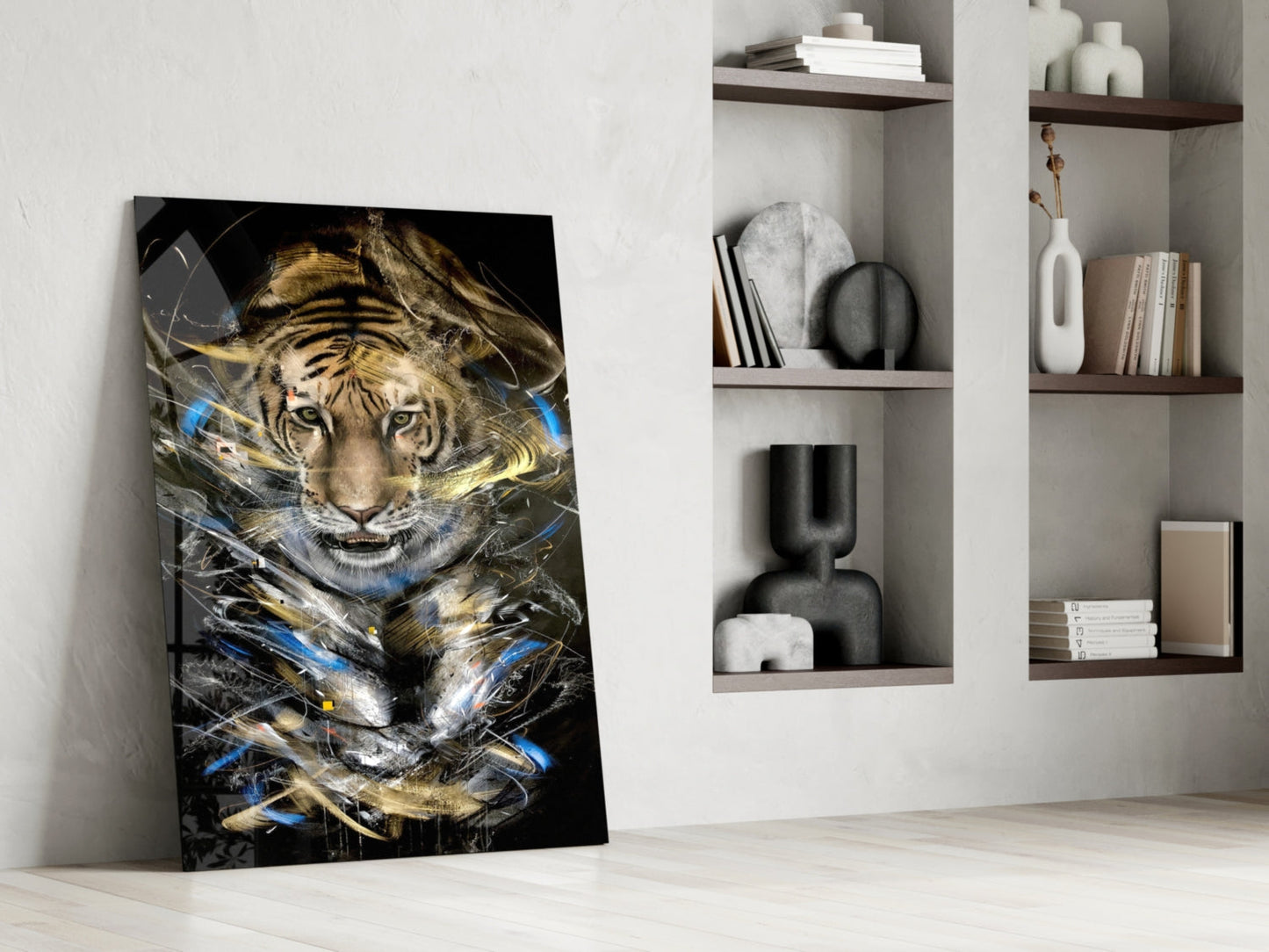 Tiger glass art leaning against white wall beside shelving, featuring golden and blue abstract streaks over tiger face on black background.
