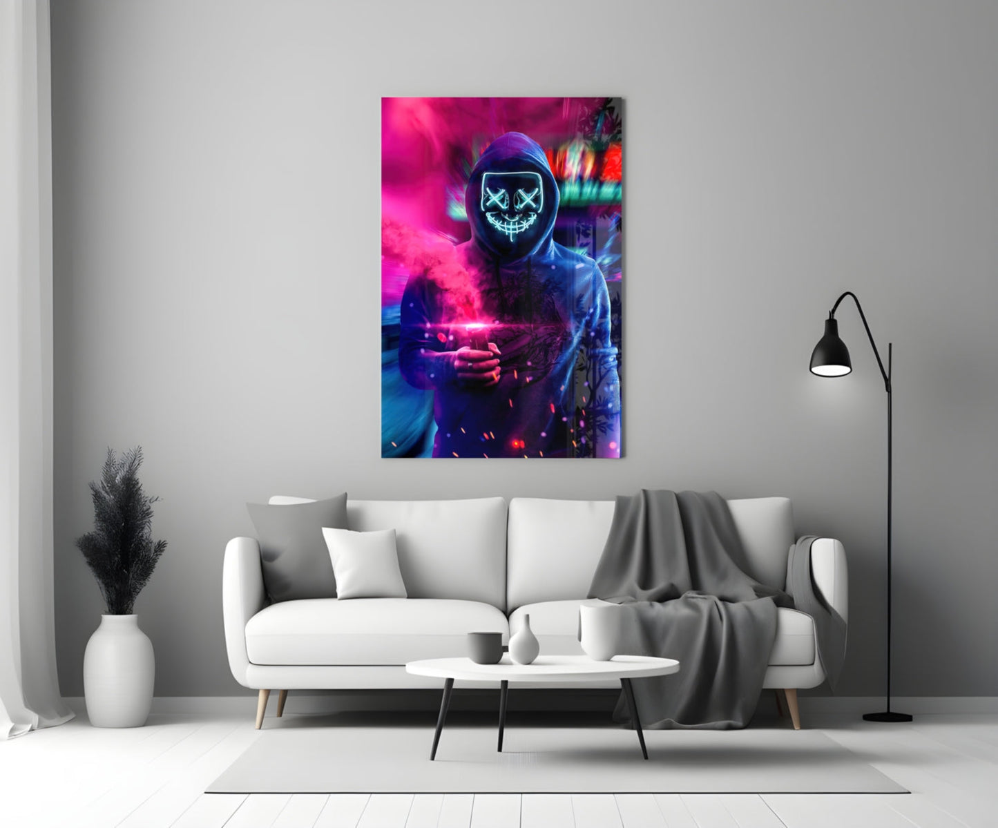 Neon Protest Glass Art depicting a hooded figure with glowing cyan X-eyes and pink neon light, displayed on a white living room wall above a sofa.