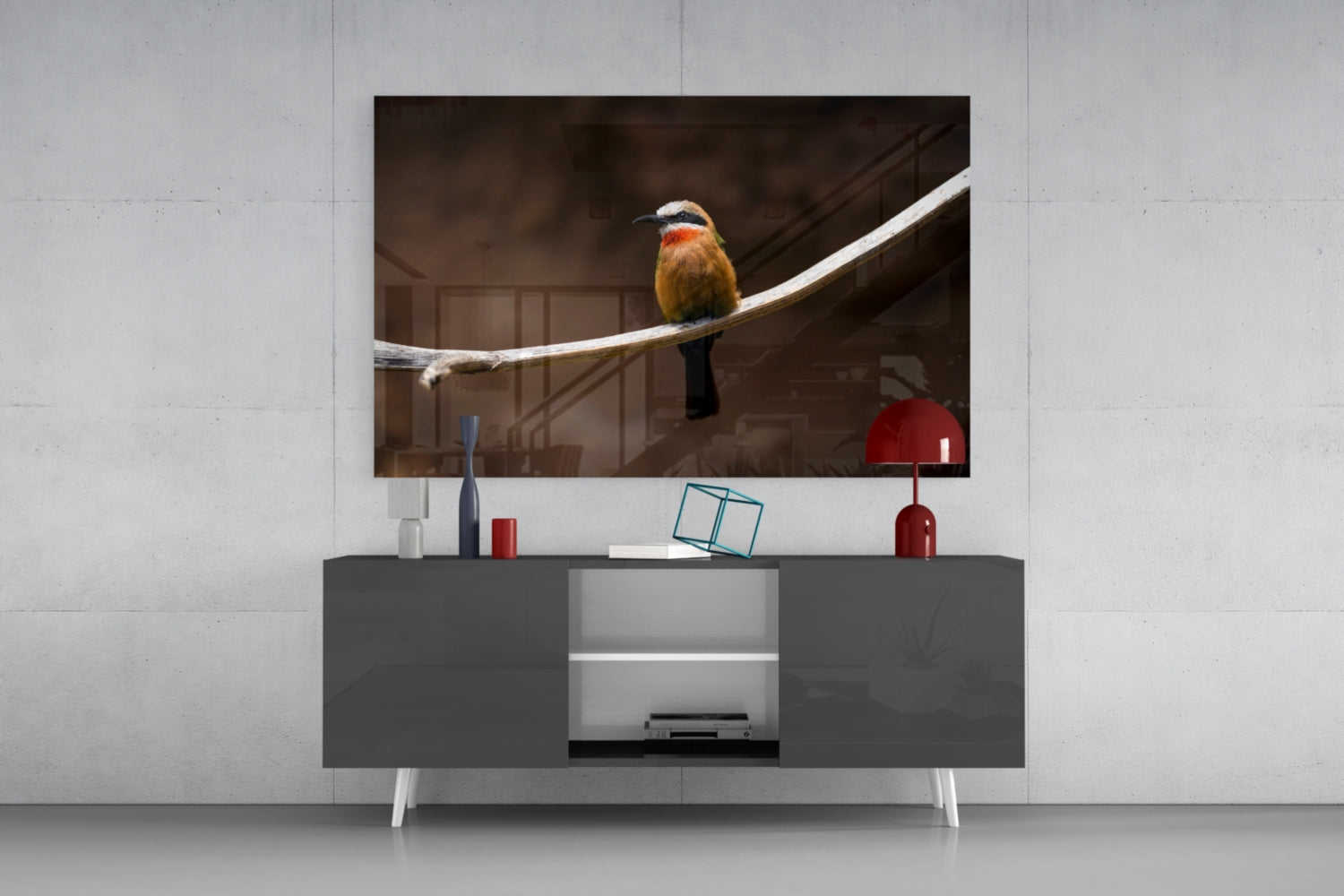 Bee Eater glass art displayed on dark wall-mounted media console showing colorful bird with orange, yellow and red plumage perched on white branch.