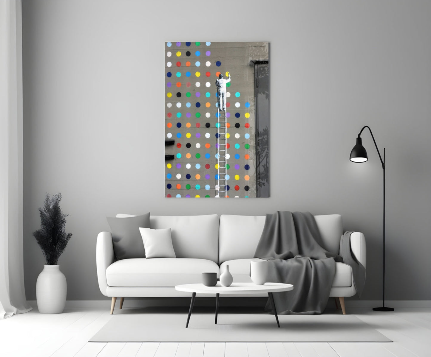 Colorful polka dot glass art panel displayed above white sofa in modern living room interior.