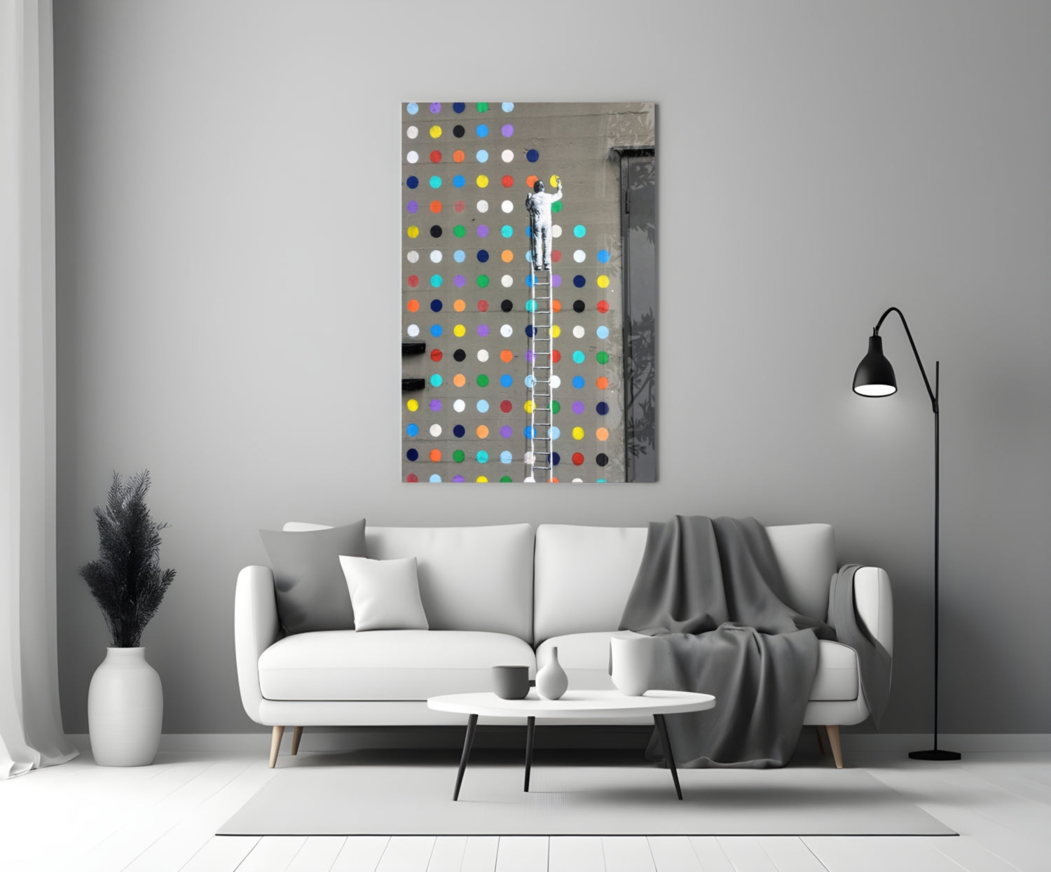 Colorful polka dot glass art panel displayed above white sofa in modern living room interior.