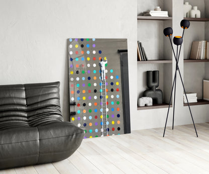 Dots Glass Art displayed in modern living room setting with black leather sofa, floor lamp, and shelving unit.