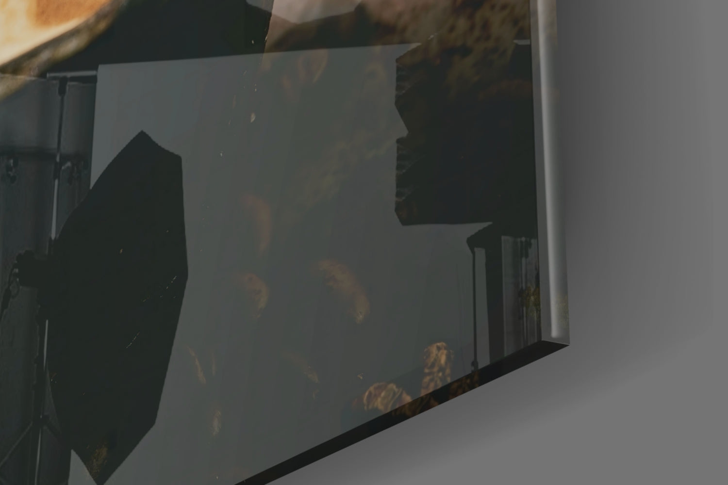 Close-up of frosted glass panel showing silhouetted coffee cup design with warm golden-brown tones visible through the glass.