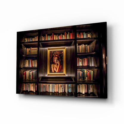 Dark wooden bookshelf with glass doors displaying colorful books and a gold-framed portrait of a woman in the center, photographed at an angle against white background.